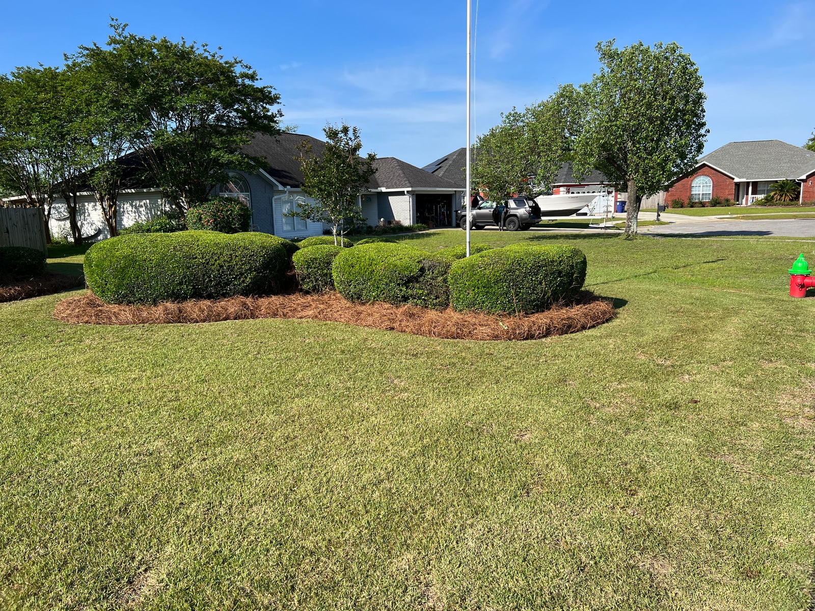 Crisp edge cut along a driveway after trimming